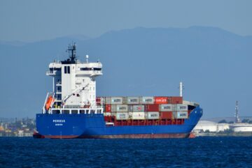 blue and white cargo ship on sea during daytime