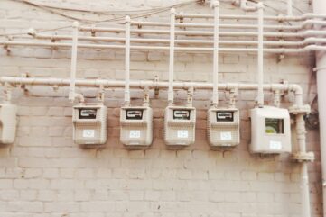 minimalist photography of beige painted electrical boxes